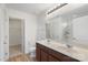 Bathroom features double sink vanity with lots of storage, a large mirror, and an enclosed toilet at 858 Rook Rd, Charlotte, NC 28216