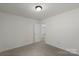 Clean bedroom with neutral color palette and plush carpet flooring at 858 Rook Rd, Charlotte, NC 28216