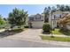 Charming two-story home with a well-manicured lawn and a two-car garage at 858 Rook Rd, Charlotte, NC 28216