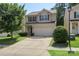 Charming two-story home with a well-manicured lawn and a two-car garage at 858 Rook Rd, Charlotte, NC 28216