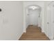 Inviting hallway with elegant wood flooring, leading to the bright and open spaces at 858 Rook Rd, Charlotte, NC 28216