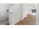 Bright staircase with wood flooring, leading to an open and airy living space at 858 Rook Rd, Charlotte, NC 28216