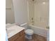 Standard bathroom featuring a tub-shower combo, toilet, and a single sink vanity at 8838 Wandering Creek Way, Charlotte, NC 28227