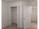 Bedroom closet with bifold doors, wire shelf, and carpeting at 8838 Wandering Creek Way, Charlotte, NC 28227