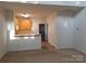 Cozy living room space flows into kitchen and features ample storage at 8838 Wandering Creek Way, Charlotte, NC 28227