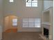 Spacious living room with fireplace and views into additional area at 8838 Wandering Creek Way, Charlotte, NC 28227