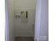 Utility closet with shelving and equipment mounted on the wall at 8838 Wandering Creek Way, Charlotte, NC 28227