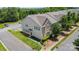 Aerial view of townhomes with manicured lawns and ample parking at 9001 Lanark Ln, Fort Mill, SC 29707