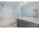 Bathroom with double sink vanity, bathtub with shower, and ceramic tile flooring at 9001 Lanark Ln, Fort Mill, SC 29707