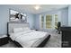Bedroom featuring a large bed, stylish decor, and a ceiling fan at 9001 Lanark Ln, Fort Mill, SC 29707
