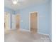 Bedroom with a ceiling fan and openings to a closet and other rooms at 9001 Lanark Ln, Fort Mill, SC 29707