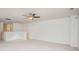 Bright bonus room features neutral carpet, a ceiling fan, and abundant natural light at 9001 Lanark Ln, Fort Mill, SC 29707