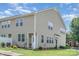 Charming two-story townhome featuring vinyl siding, manicured lawn, and inviting front entrance at 9001 Lanark Ln, Fort Mill, SC 29707