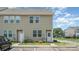 Well-maintained townhouse with manicured lawn, inviting front entrance, and ample parking at 9001 Lanark Ln, Fort Mill, SC 29707
