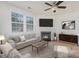 Cozy living room featuring a fireplace, neutral tones, and ample seating at 9001 Lanark Ln, Fort Mill, SC 29707