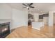 Open floor plan features living room fireplace and kitchen with granite island at 9001 Lanark Ln, Fort Mill, SC 29707