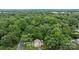 Aerial view of home surrounded by lush green trees and landscape at 906 Wishing Well Ln, Charlotte, NC 28270