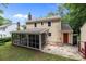Rear exterior with a screened porch, brick patio, and shed, set in a private backyard at 906 Wishing Well Ln, Charlotte, NC 28270