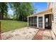 Backyard with a screened-in porch and gravel area perfect for relaxing or entertaining at 906 Wishing Well Ln, Charlotte, NC 28270
