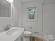Bright bathroom featuring modern fixtures, white subway tiles, and a clean, updated vanity at 906 Wishing Well Ln, Charlotte, NC 28270