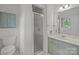 Bathroom featuring glass shower door, toilet and modern sink at 906 Wishing Well Ln, Charlotte, NC 28270