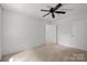 Spacious bedroom featuring carpet, a ceiling fan, and two closets at 906 Wishing Well Ln, Charlotte, NC 28270