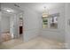 Bright dining room with tile flooring, a window, and a view to the outside at 906 Wishing Well Ln, Charlotte, NC 28270