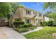 View of a well-maintained two-story home with manicured landscaping and a charming walkway at 906 Wishing Well Ln, Charlotte, NC 28270