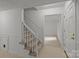 Inviting foyer with staircase and neutral tile flooring at 906 Wishing Well Ln, Charlotte, NC 28270