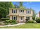 Charming two-story home featuring traditional architecture, a well-manicured lawn, and inviting front porch at 906 Wishing Well Ln, Charlotte, NC 28270