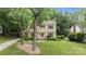 Lovely two-story home with a well-manicured lawn and green shutters at 906 Wishing Well Ln, Charlotte, NC 28270