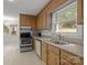 Bright kitchen featuring wooden cabinets and natural light at 906 Wishing Well Ln, Charlotte, NC 28270