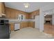 Traditional kitchen with wooden cabinets and functional appliances at 906 Wishing Well Ln, Charlotte, NC 28270