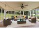 Relaxing screened patio with comfortable outdoor furniture at 906 Wishing Well Ln, Charlotte, NC 28270