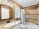 Neutral bathroom with tiled shower, granite vanity, and decorative light fixture at 9908 Park Springs Ct, Charlotte, NC 28210