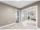 Neutral bonus room with sliding glass doors to another room at 9908 Park Springs Ct, Charlotte, NC 28210