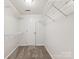 Walk-in closet with ample shelving and carpeted floors, providing storage and organization at 9908 Park Springs Ct, Charlotte, NC 28210