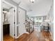 Inviting foyer with hardwood floors, staircase, and an open view to a bright living room with natural light at 9908 Park Springs Ct, Charlotte, NC 28210