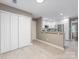 Hallway featuring a closet adjacent to a partially visible kitchen at 9908 Park Springs Ct, Charlotte, NC 28210