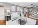 Cozy living room featuring a comfortable sofa, modern decor, and a view of the entryway at 9908 Park Springs Ct, Charlotte, NC 28210