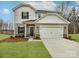 Charming two-story home with a two-car garage, manicured lawn, and inviting front entrance at 1117 Morehead Dr, Salisbury, NC 28144