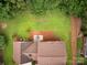 Aerial view of a backyard with a brick patio dining space at 113 Foxfield Ln, Matthews, NC 28105