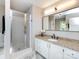 A well lit bathroom with a large vanity with a granite countertop and a shower at 113 Foxfield Ln, Matthews, NC 28105