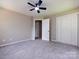 A bedroom with a large closet with folding doors at 113 Foxfield Ln, Matthews, NC 28105