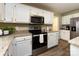 Modern kitchen featuring stainless steel appliances and granite countertops at 113 Foxfield Ln, Matthews, NC 28105