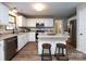 Bright kitchen features granite counters, stainless appliances, and white cabinetry at 113 Foxfield Ln, Matthews, NC 28105