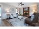 Cozy living room with brick fireplace, neutral decor, and ample seating at 113 Foxfield Ln, Matthews, NC 28105