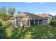 Aerial view of backyard with screened porch and manicured lawn at 114 Canoe Pole Ln, Mooresville, NC 28117