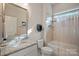 Cozy bathroom with granite countertop, shower and bath tub combo at 114 Canoe Pole Ln, Mooresville, NC 28117