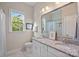 Dual sink bathroom with lots of natural light from the window at 114 Canoe Pole Ln, Mooresville, NC 28117